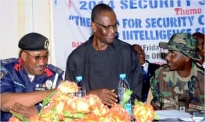 From Left: Commandant, Nigeria Security and Civil Defence Corps (Nscdc) Enugu State, Mr Nathaniel Ubong, representative of Enugu State Government, Mr Chime Richard and representative of Commandant, Nigerian Army 82 Garrison, Capt. Umar Garba, at the Nscdc 2014 Security Summit in Enugu last Friday. Photo: NAN