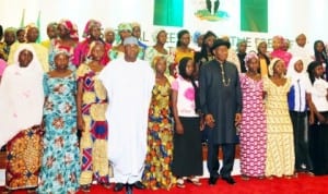 President Goodluck Jonathan (5th right), Senate President David Mark (4th left)in  a  group photograph with parents and some Chibok Girls during their visit to  the Presidential Villa in Abuja, yesterday.
