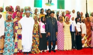 President Goodluck Jonathan (7th-l), Senate President, David Mark (4th-l) in a group photograph with parents and some Chibok Girls, during their visit to  Presidential Villa in Abuja, yesterday