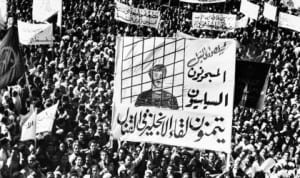       A huge banner demanding release of political prisoners is carried by Egyptians in a procession through Cairo streets in 1951 as a three-day 'Hate Britain' campaign is started. It is part of the Egyptian attempt to get the British out of Egypt and the Egyptians into the Sudan. Most of the political prisoners are members of the Moslem Brotherhood. (AP Photo) 