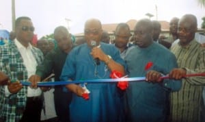 Rivers State Chairman of the All Progressives Congress (APC), Dr. Davies Ibiamu Ikanya (middle), cutting the tape to commission APC Secretariat in Okrika. With him are Chairman, CTC, Okrika Local Government Area,  Dr Godknows Tam George (left), State Commissioner for Health,  Dr Sampson Parker and APC  leader in Okrika, Mr D. D. Alabere (first right). Photo: Egberi  A. Sampson