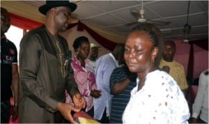Senator Magnus Abe, right) presenting wrapper to a woman in Opobo Town on Wednesday, during his senatorial empowerment programme tour of Opobo/Nkoro Local Government Area. Photo: Donatus Ken Nwiveh