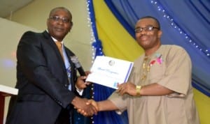 General Manager Rivers State Newspaper Corporation, Mr. Celestine Ogolo (right) receiving an award from the past President of Rotary Club of Port Harcourt, Rtn, Chidi Ikeji, during the induction ceremony of Rtn Frank Eni at Rotary centre Trans-Amadi, Port Harcourt, recently. Pix: Nwiueh Donatus Ken.