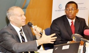 Lead economist, nigeria country office, World Bank, Mr John Litwack (left) and  communications associate, Africa strategic communication, World Bank, Mr Dele  Oladokun, during the presentation of World Bank, Nigeria economic report in Abuja last Tuesday. Photo: NAN