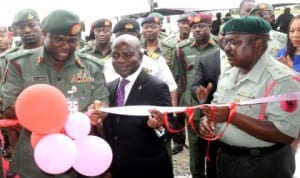 L-R: Chief of Army Staff, Lt.-Gen. Kenneth Minimah, Group Managing Director, Diamond Bank, Dr Alex Otti and Commanding Officer, 65 Battalion, Lt.-Col. Haruna Dasuki, commissioning an ultra modern block for the battalion in Lagos last Tuesday. Photo: NAN