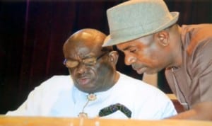 Clerk of the Rivers State House of Assembly, Sir Emmanuel Ogele (left) listens to his deputy, Mr. Dumnu Lekie (right) at the sitting of the House, last Monday.