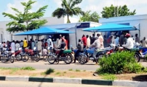 People queuing to cash money from Atm in Bauchi, recently.