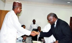 L-R: Governor Isa Yuguda of Bauchi State (left), congratulating the New Acting Chief Judge of the State, Justice Aliyu Liman, at the swearing-in in Bauchi recently. Photo: NAN