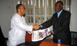 General Manager, Rivers State Newspaper Corporation (RSNC), Mr Celestine Ogolo (left), presenting some copies of Tide Newspaper to the Chairman, 80 County Run, Comrade, M.O. Raleigh - Joe,  during the offical visit of the group to the corporation last Tuesday. Photo: Nwiueh Donatus Ken