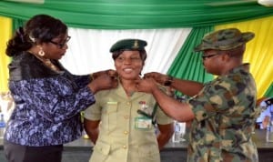 Commander, Nigeria Drugs Law Enforcement Agency, Rivers State Command, Shellang Rachael (left) , with Lt. Col Kingsely Adimoha of the Nigerian Army (right), decorating Public Relations Officer of Nigeria Prisons Service, Rivers State Command, Mrs Juliet Ofoni, at the decoration of newly promoted officers of the command in Port Harcourt recently. Photo: Ibioye Diama