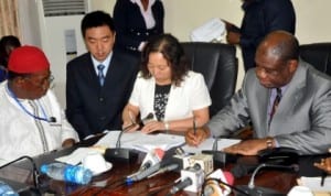 L-R:  Chairman, Liaoning Efacec, Chief Sam Amyamele, Vice President, Engineering, Mr Li Jiawei, Vice President, International, Ms Hliang Xae Li and Minister of Power, Prof. Chinedu Nebo, signing a memorandum on power in Abuja, recently.