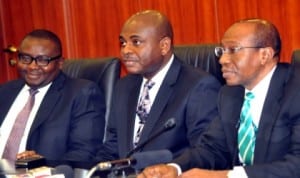 Governor, Central Bank of Nigeria, Mr Godwin Emefiele (right), addressing participants at the Monetary Policy Committee meeting in Abuja, recently. With him are Deputy Governor, Finance System Stability, Dr Kingsley Moghalu (middle) and Deputy Governor, Corporate Services, Mr Adebayo Adelabu. Photo: NAN