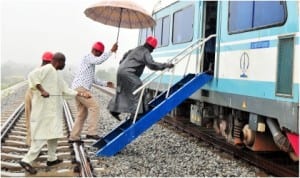 Chairman, Subsidy Reinvestment and Empowerment Programme (SURE-P), Retired Gen. Martin Lurther-Agwai (right), boarding a train during inspection of Light Rail Project in Abuja, last Friday 