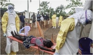 Medical personnel carrying an Ebola virus victim in Lagos, recently