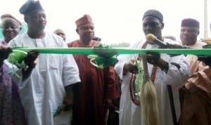 Olomu of Omu-Aran, Oba Charles Ibitoye (middle), Chairman, Irepodun Local Government Area, Mr Luqman Owolewa and other officials, at the inauguration of a gari processing plant in Omu-Aran, Kwara last Friday. Photo: NAN
