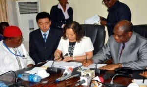 L-R: Chairman, Liaoning Efacec, Chief Sam Amyamele, Vice President, Engineering, Mr Li Jiawei; Vice President, International, Ms Hliang Xae Li and Minister of Power, Prof. Chinedu Nebo, signing a memorandum on power in Abuja, recently. Photo: NAN