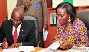 Executive Secretary, Nigerian Educational Research and Development Council (NERDC),  Prof. Godswill Obioma (left)  and Executive Secretary, National Agency for the Prohibition of  Traffic In Persons (NAPTIP), Mrs Beatrice Jedy-Agba, signing MoU on  Mainstream Trafficking in Persons into Curricula of Primary and Secondary schools in Nigeria, in Abuja, recently. Photo: NAN