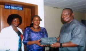 Specail Adviser to Rivers State Governor on ICT, Engr Goodliffe Nmekini (right), presenting Ipads to Head of Paediatrics Department, Braitwaite Memorial Hospital, Dr Ajibola Alabi (middle).  With them is, Dr Josephine Aiyafo, durig inspection of ICT facilities at the hospital in Port Harcourt recently. Photo: Egberi A. Sampson