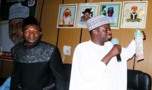 Former Minister of Health, Dr Idi Hong, displaying his form of intention to contest for Adamawa governorship bye election  to his supporters,  before presenting it to the Secretary, PDP Adamawa State Branch, Mr Tahir Shehu (left), in Yola, recently.