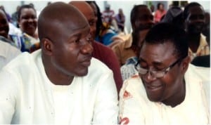 Chief of Staff, Government House, Port Harcourt, Sir Tony Okocha (left) listening to the Deputy Chairman of the All Progressives Congress (APC), Prince Peter Odike, during the commissioning of water project at Abam/Igbiri ward 5 Okrika, recently