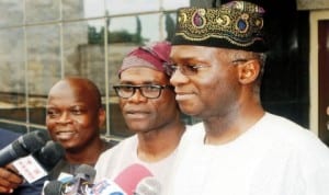 Gov. Babatunde Fashola of Lagos State (right) speaking to newsmen on Ebola virus on his arrival from Lesser Hajj in Lagos recently. With him are, his Special Adviser on Media, Mr Hakeem Bello (left) and  Commissioner for Information and Strategy, Mr Lateef Ibirogba. Photo: NAN