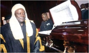 Speaker, Rivers State House of Assembly, Rt Hon Otelemaba Amachree , paying his last respects to the body of late first Speaker of the  State Assembly, Late Chief R.R.Briggs, during a valedictory session in Port Harcourt. Photo: Chris Monyanaga