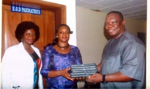 Special Adviser to the Rivers State Governor on ICT, Engr. Goodliffe Nmekini (right), presenting Ipads to HoD, Paediatrics, BMSH, Dr Ajibola Alabi (middle), during inspection of ICT facilities at the hospital recently. With them is Dr Josephine Aiyafo.