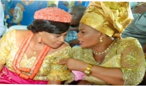Wife of the Deputy Clerk, Rivers State House of Assembly, Mrs Theresa Dumnu (left), conferring with wife of Head, News, RSTV, Mrs Edina Chu, during the thanksgiving and dedication of the twin children of the former  in Port Harcourt last Sunday. Photo: Chris Monyanaga 