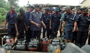 Commander General of NSCDC, Dr Ade Abolurin (3rd-left),  inspecting seized jerry cans of Petrol from vandals during his tour of Oke-Oko Isawo in Ikorodu, Lagos State recently.