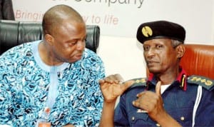 Chief Finance Officer, Ikeja Electricity Distribution Company, Mr Aigbe Olotun (left) and Commandant General,  Nigeria Security and Civil Defence Corps (NSCDC), Dr Ade Abolurin, during the visit of  Commandant-General to the company in Lagos recently. Photo: NAN