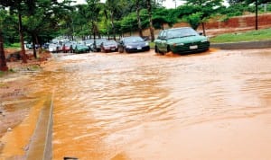 Flooded road at Area 8, Garki, after a downpour in Abuja recently. Photo: NAN