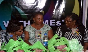 Development Finance Officer, CBN, PHC, Madam Augustina Osuya (right) listening to Mrs. Ifeoma Ben-Ushie of NYSC (left) during the 2014 International Entrepreneur Business Summit at Ministry of Justice Conference Hall Port Harcourt, recently, with Mrs. Helen Ampege of NYSC. Pix: Nwiueh Donatus Ken. 