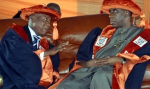 Rivers State Governor, Rt Hon Chibuike Amaechi (right), exchanging pleasantries with the Rector, Rivers State Polytechnic, Bori, Sir Obianko Nwolu-Elechi,  during the 18th – 20thConvocation ceremony of the institution last Saturday. Photo: Nwivueh Donatus Ken