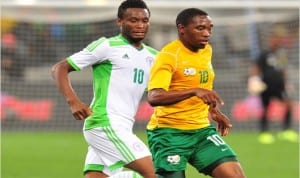 Super Eagles midfielder, Mikel Obi (10) against a South African player in the goalless draw in Cape Town