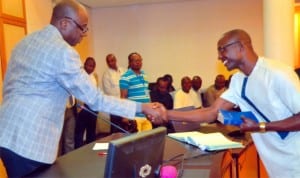 Rivers State Governor, Rt Hon Chibuike Amaechi (left) congratulating the Caretaker Committee Chairman of Tai LGA, Hon Mbakpone Okpie, during the swearing-in ceremony at Government House, Port Harcourt, recently. Photo: Chris Monyanaga
