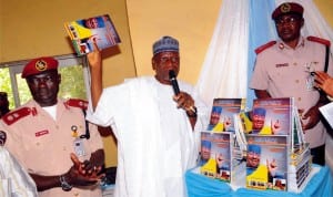 L-R: Frsc Sector Commander, RS 4.1, Plateau Command, Mr Sunday Maku, representative of Plateau State Governor, Mr Abubakar Dashe and Zonal Commanding Officer, Mr Yakubu Attah, at the Public presentation of Frsc Zone 4 in-house Magazine in Jos, recently.  Photo: NAN