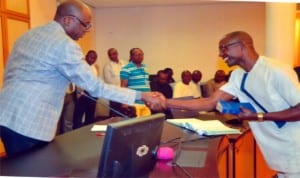 Governor Amaechi (left) congratulating Chairman, Care-Taker Committee, Tai LGA., Mr. Mbakpone Okpie. Photo: Chris Monyanaga 