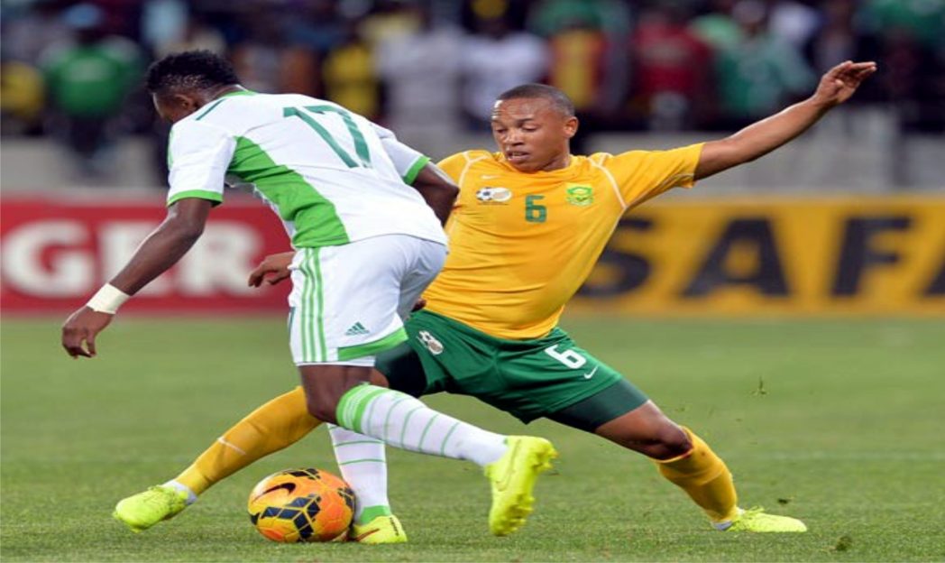 A South African midfielder (6) in contest with Nigeria’s Onazi Ogenyi when the two countries clashed in a 2015 AFCON Qualifier last month.