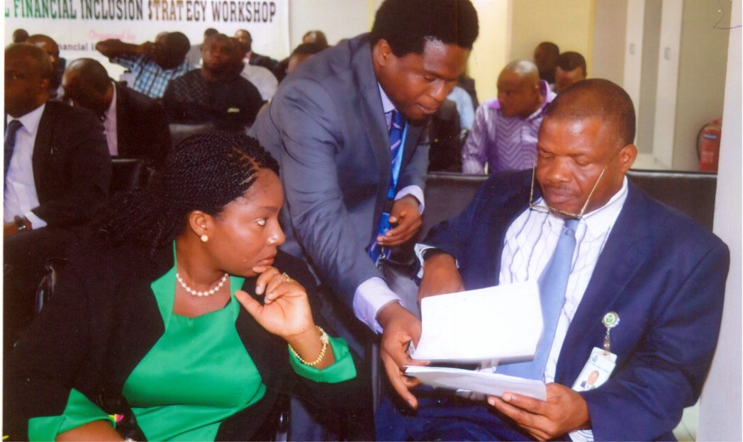 Head Financial Inclusion, Mrs Akin-Fadeyi, CBN Secretariat, Temitope (left), with Corporate Communication Officer, CBN, Mr Obinali Okoli (middle) and Assistant Director, CBN Mr Eze Okone, during the workshop on Financial Inclusion by the CBN at Port Harcourt CBN branch on Tuesday 14 October 2014. Photo: Chris Monyanaga