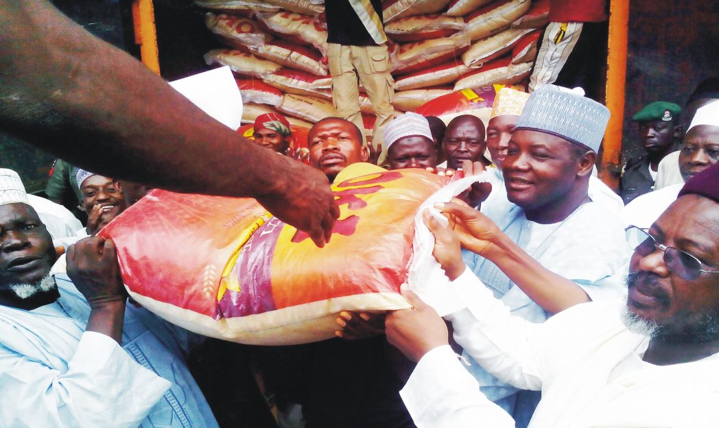 Nigeria's Ambassador to Morocco, Senator Abdallah Wali (right), presenting N60m worth of rice to Sokoto State in Sokoto, recently. Photo NAN