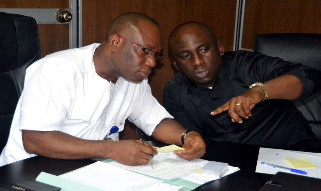 Perm Sect Ministry of Tansport Mr, Nuka Nwikpasi (left) lislering to consullant Mr. Jude Ndubusi during a stakeholders meeting of Transport Company and the Ministry on frid;;ay 31st Oct, 2014 and Rivers State Secretariat Complex Port Harcourt. Photo: Nwiueh Donatus Ken