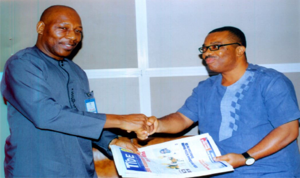General Manager, RSNC, Mr Celestine Ogolo (right), presenting some copies of The Tide Newspaper to Vice Chairman, Nigerian Institute of Quantity Surveyors, Rivers State Chapter, Mr Edegoma Isaac Ewa, during the association’s courtesy visit to the corporation last Friday. Photo: Egberi A. Sampson
