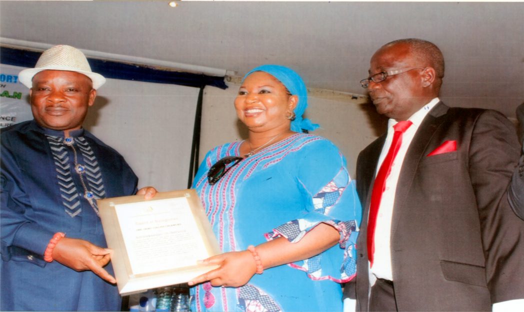 Nye Nwe-Eli and Paramount Ruler of Rukpokwu, HRH. Eze (Dr) Collions C. Ogwu III (left), posing with his Ambassador Award. With him is his wife, Lady Beatrice Ogwu and President, Church Management Suppport Ministry, Dr Kayode Nissi, during the 2014 National Conference, recently. Photo: Egberi A. Sampson