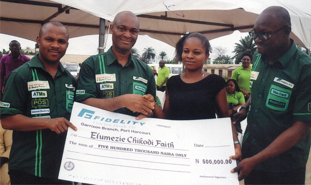 Mazi Charles Okoro, (2nd left) Regional Bank Head of Fidelity Bank South-South in a handshake congratulating Miss Faith Elumezie Chikodi one of the winners of the Fidelity Save for Scholarship promo organised by the bank in Port Harcourt, recently. Flanked (right) Anthony Onah, Head SME Rivers/Bayelsa Region and Uchenna Oparah Head of e-banking/sales.