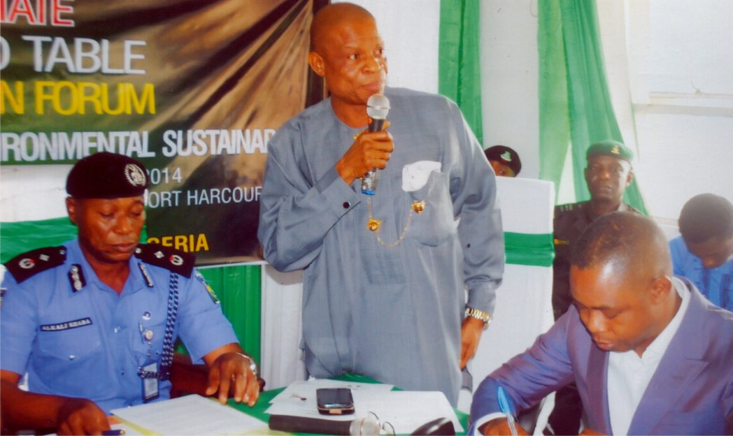 Rivers State Director, National Orientation Agency, Mr Oliver Wolugbom (middle) delivering an address, during the 14th Rivers State NOA roundtable, in Port Harcourt, recently. With him are Sole Administrator, Rivers Waste Management Agency, Mr Ade Adeogun (right) and a police officer. Photo: Prince Obinna Dele