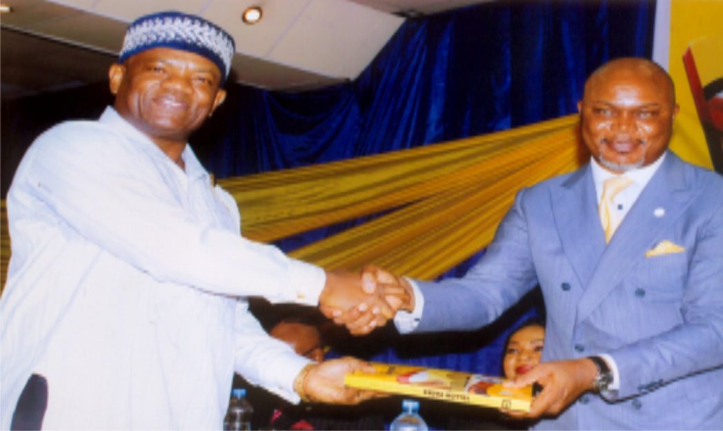 Rivers State Commissioner for Commerce and Industry, Hon. Chuma C. Chinye (right) in handshake with Administrative Director, MCC, Mr Nelson Jaja (left) at the public presentation of the Yellow Pages Directory organised by Ministry of Commerce and Industry in Portr Harcourt. Photo: Egberi .A. Sampson