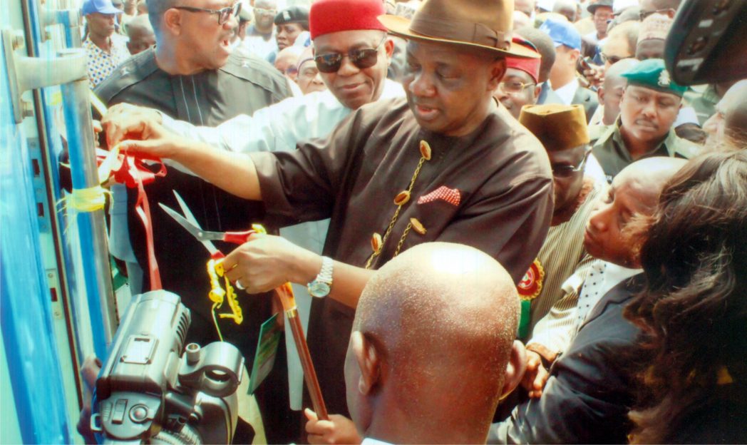 Vice President Nemadi Sambo cutting the tap at the official commissioning of Enugu-Port Harcourt rail line. With him are Abia State Governor, Theodore Orji (2nd left) and former Anambra State Governor, Peter Obi (left).