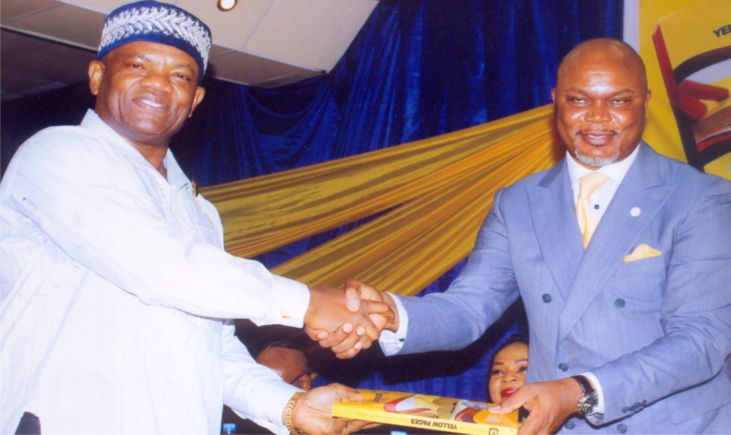 Rivers State Commissioner for Commerce and Industry, Hon. Chuma C. Chinye (right) in handshake with Administrative Director MCC, Mr. Nelson Jaja (left) in the public presentation of the Yellow Pages Directory, orgnaised by Ministry of Commerce and Industry in Port Harcourt recently. Photo: Egberi A. Sampson