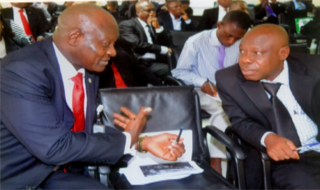 Assistant Director, Development Finance Department, CBN, Mr Babalunde O. Ogunlaja (left) with Manager, NAICOM, Port Harcourt, Mr Emma Ndukuba during a workshop on Financial Inclusion, CBN, Port Harcourt recently. Photo: Chris Monyanaga