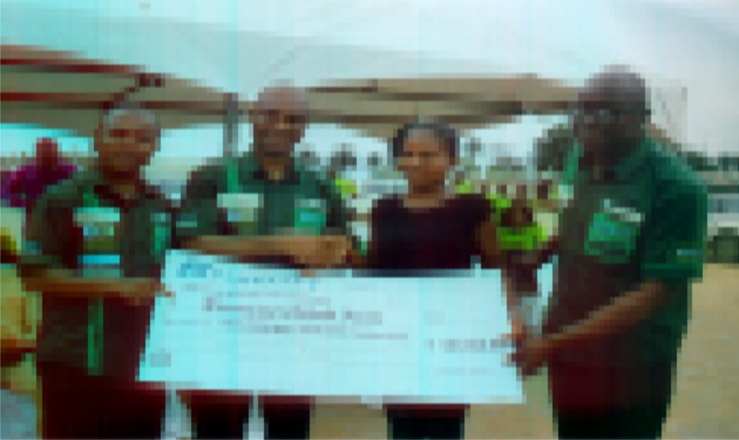 Mazi Charles Okoro (2nd left) Regional Banker/Head of Fidelity Bank South-South in a handshake congratulating Miss Faith Chikodi Elumezie, one of the winners of the Fidelity Save for Scholarship at a promo organised by the bank in Port Harcourt, flanked are Uchenna Opara, Head of e-banking/Sales and Anthony Onah, Head SME, Rivers/Bayelsa region. Photo: Ibioye Diama